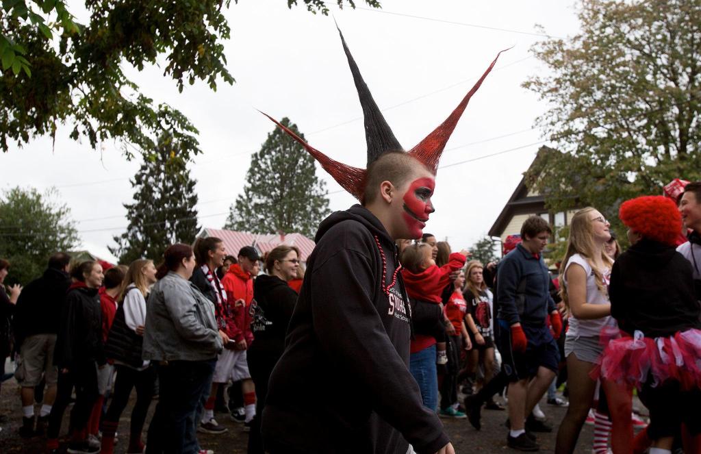 Freshman Troy Pennamen sports three red-and-black spikes in his hair. He was among about 1,500 Snohomish High School students who walked in the annual Serpentine Parade in Snohomish on Friday. (Andy Bronson / The Herald)
