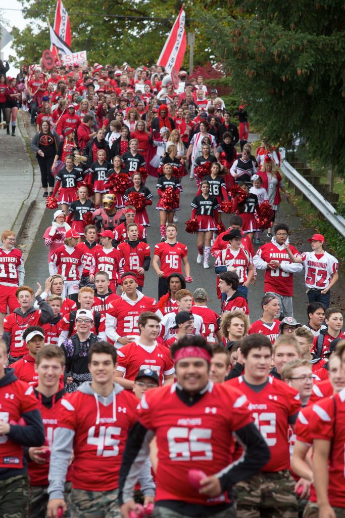 Snohomish High School students walk down Fifth Street in the annual Serpentine Parade on Friday. (Andy Bronson / The Herald)