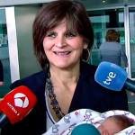 In this screen grab taken from video Tuesday, Oct. 18, Lina Alvarez leaves Lucas Augusti Hospital with her healthy newborn baby, in Madrid, Spain. The 62-year-old Spanish woman encourages women in their later years to imitate her if they want to. (Atlas TV via AP)