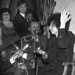 In this May 22, 1966, photo, Bob Dylan gestures during a news conference in Paris, France. Dylan won the 2016 Nobel Prize in literature Thursday, a stunning announcement that for the first time bestowed the prestigious award on a musician for &ldquo;having created new poetic expressions within the great American song tradition.&rdquo; (AP Photo/Pierre Godot, File)