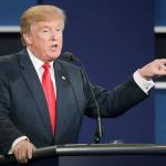 Republican presidential nominee Donald Trump points toward Democratic presidential nominee Hillary Clinton as he answers a question during the third presidential debate at UNLV in Las Vegas on Wednesday. (AP Photo/John Locher)