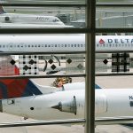 Delta Air Lines planes parked at Ronald Reagan Washington National Airport in Washington, D.C., in August. (AP Photo/Carolyn Kaster, File)