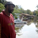 William Murrell stands at the edge of his property, which is partially underwater, on Cedar Lane in Kinston, North Carolina, on Friday. (Zach Frailey/Daily Free Press)