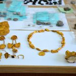 Gold jewellery, including butterfly-shaped objects and a ring picturing the goddess Athena, are displayed in Patras, Greece, on Wednesday. (Greek Police)