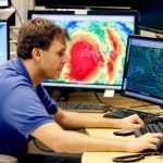Hurricane specialist Eric Blake monitors the path of Hurricane Matthew at the National Hurricane Center on Tuesday in Miami. (AP Photo/Lynne Sladky)