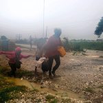 Residents head to a shelter in Leogane, Haiti, on Tuesday. (AP Photo/Dieu Nalio Chery)