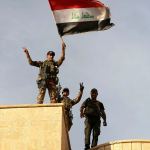 Iraq&rsquo;s elite counterterrorism forces raise an Iraqi flag after retaking Bartella, outside Mosul, Iraq, Friday, Oct. 21, 2016. Iraqi and Kurdish forces backed by a U.S.-led coalition launched a multi-pronged assault this week to retake Mosul and surrounding areas from IS. The operation is the largest undertaken by the Iraqi military since the 2003 U.S.-led invasion. Iraqi officials said they had advanced as far as the town of Bartella, 15 kilometers (nine miles) from Mosul&rsquo;s outskirts, by Thursday. (AP Photo/ Khalid Mohammed)