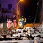 Rescuers stand by rubble in the village of Visso, central Italy, on Wednesday, Oct. 26, following an earthquake. (Matteo Crocchioni/ANSA via AP)