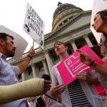 Brandi Jensen (center), shares her opinions with an anti-abortion protester as the Planned Parenthood Action Council holds a rally at the state Capitol in Salt Lake City in 2015. (Leah Hogsten/The Salt Lake Tribune)