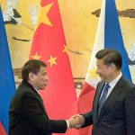 Philippine President Rodrigo Duterte, left, and Chinese President Xi Jinping shake hands after a signing ceremony in Beijing, China, on Thursday, Oct. 20. Duterte was meeting Thursday with Xi in Beijing as part of a charm offensive aimed at seeking trade and support from the Asian giant by setting aside a thorny territorial dispute. (AP Photo/Ng Han Guan, Pool)