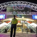 A member of the security team stands in front of the presidential debate site at the University of Nevada, Las Vegas late Sunday, Oct 16. Democratic presidential nominee Hillary Clinton and Republican presidential nominee Donald Trump will meet in their third and final debate on Wednesday. (AP Photo/J. David Ake)