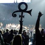 A Prince fan holds up his symbol on Oct. 13 in St. Paul, Minnesota, during a tribute concert honoring the late musician who died in April. (AP Photo/Jim Mone)