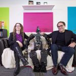 Kindred CTO and founder Suzanne Gildert (left), and CEO and founder Geordie Rose sit with Thormang, a full scale humanoid robot used for research, at the company&rsquo;s offices in Vancouver, B.C., on October 19. (Bloomberg / Darryl Dyck)