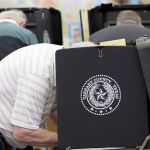 In this March 1, 2016, photo, voters make their choice in the ballot booth during primary election day at Sherrod Elementary School in Arlington, Texas. Officials in Texas, Oklahoma and Louisiana say they&rsquo;ve denied a request by Russian officials to be present at polling stations during the November general election. (AP Photo/LM Otero, File)