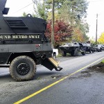 Multiple arrests were made Friday when Monroe police raided a suspected drug house along S. Lewis Street. (Monroe Police)