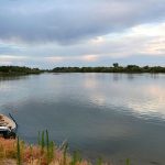 In this 2014 photo, a fisherman stands in his boat looking across the Snake River near Homedale, Idaho. (Roger Phillips /Idaho Statesman via AP, File)