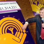 In this 2001 photo, A. Dale Cannady, the 2001 United Way campaign chairman in Richmond, Virginia, announces the total raised during the annual fund raising at a press conference at the Richmond Center in Richmond. (Clement Britt/Richmond Times-Dispatch via AP, File)