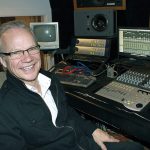 In this Dec. 18, 2013, photo, Bobby Vee poses at the studio console at his family&rsquo;s Rockhouse Productions in St. Joseph, Minnesota. Vee, whose rise toward stardom began as a 15-year-old fill-in for Buddy Holly after Holly was killed in a plane crash, died Monday, Oct. 24, of complications from Alzheimer&rsquo;s disease. He was 73. (AP Photo/Jeff Baenen, File)