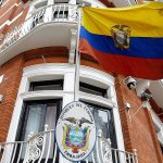 The Ecuadorian national flag flies outside their London Embassy on Oct. 18. Midway through releasing a series of damaging disclosures about U.S. presidential contender Hillary Clinton, WikiLeaks founder Julian Assange said his hosts at the Ecuadorean Embassy in London abruptly cut him off from the internet. (AP Photo/Alastair Grant)