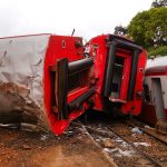 A derailed train with coaches on their sides in Eseka, Cameroon, on Saturday, Oct. 22. Rescue workers dug through the rubble Saturday in search of more injured and dead after a train traveling between two major cities in Cameroon derailed in Eseka, killing at scores of people, said rescue workers and hospital staff. (AP Photo/Joel Kouam)