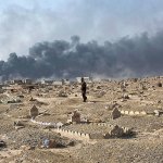 Abdel el Razak Talab carries a gravestone at a graveyard damaged by Islamic State extremists in Qayara, some 31 miles south of Mosul, Iraq, on Thursday, Oct. 27. When IS overran Qayara more than two years ago, the extremist group began destroying headstones at the local graveyard, telling residents they were forbidden because they did not exist at the time of the prophet. (AP Photo/Marko Drobnjakovic)
