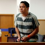 Bunthoeun Nem stands to go before the bench and be sentenced for the 2005 shooting death of Jessie Williams, Thursday morning at Snohomish County Superior Court. (Dan Bates / The Herald)