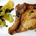 Asian-marinated pork chops with bok choy. (Photo by Deb Lindsey for The Washington Post