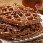 Pumpkin puree is folded into waffle batter for a deeply flavored twist on breakfast. (E. Jason Wambsgans / Chicago Tribune/TNS)