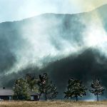 Fire makes its way up Signal Mountain in the Beulah Hill Fire east of Beulah, Colorado, on Oct. 4. A wildfire that has forced hundreds of evacuations in southern Colorado destroyed at least eight homes. (Bryan Kelsen/The Pueblo Chieftain via AP)