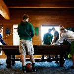 Jimmy Mead, 16 (left) faces off in a game of pool with Brevin Ross, 15 (right) while Max Pickard, 15 (center) Ian Ayers, 15, Fisher Ayers, 17, and Justin Draper (16 (far right) watch, Wednesday after attending a Darrington Youth Coalition meeting at the newly acquired North counties Family Services building at 1015 Seeman St. in Darrington. (Dan Bates / The Herald)