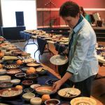 Beth Scruggs, of Lake Stevens, browses the selection of handmade bowls Saturday afternoon at Lake Stevens Calvary Chapel. (Kevin Clark / The Herald)