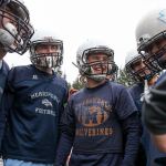 Members of the Meadowdale offense huddle during practice Thursday afternoon at Meadowdale High School in Lynnwood. (Kevin Clark / The Herald)