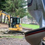 Crews work at Church Creek Park on Friday afternoon in Stanwood. (Kevin Clark / The Herald)