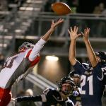 Arlington&rsquo;s Cameron McCormack catches a two-point conversion over the outstretched hand of Stanwood&rsquo;s Payton Greene during the annual Stilly Cup football game Friday night in Arlington. (Kevin Clark / The Herald)