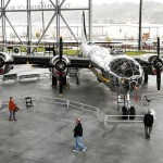 Guests walk around the T-Square 54 Boeing B-29 bomber plane at the Museum of Flight&rsquo;s Aviation Pavilion in Seattle on Thursday. (Ian Terry / The Herald)