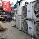 In this May 17 photo, an Indian boy of a migrant daily wageworker sleeps in scorching summer temperatures near an air conditioner shop at a marketplace in New Delhi, India. Greenhouse gases more powerful than carbon dioxide are the focus of a global gathering this week in Rwanda, with Secretary of State John Kerry expected to arrive Thursday to apply pressure for a deal to quickly phase out hydrofluorocarbons which are used in air conditioners, refrigerators, and insulating foams. (AP Photo/Altaf Qadri, File)