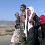 This image made from video by Rudaw News Agency shows a family fleeing Mosul, Iraq on Tuesday, Oct. 18. (Rudaw News Agency via AP)