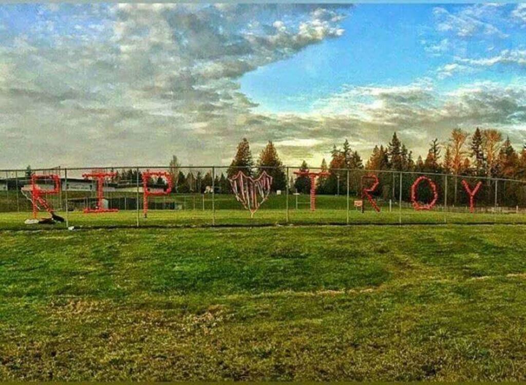 Red cups in the fence in front of Stanwood High School spell out &ldquo;RIP Troy&rdquo; after a student killed himself in January 2015. He was one of three Stanwood High students who died by suicide last year. The community has rallied to focus on suicide prevention. (Courtesy photo)