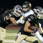 Lake Stevens&rsquo; Blake May rushes for the end zone with teammate Zack Kylany blocking Monroe&rsquo;s Ricky Baker during a game Friday at Lake Stevens High School. (Kevin Clark / The Herald)