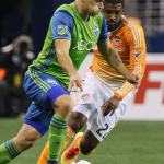 The Sounders&rsquo; Jordan Morris controls the ball with the Dynamo&rsquo;s Sheanon Williams trailing Wednesday night at Century Link Field in Seattle. (Kevin Clark / The Herald)
