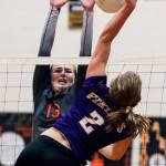 Lake Stevens&rsquo; Lilly Eason attempts a kill against Monroe&rsquo;s Samantha Zimmerman on Thursday night during the Vikings&rsquo; five-set win over the Bearcats in Monroe. (Kevin Clark / The Herald)