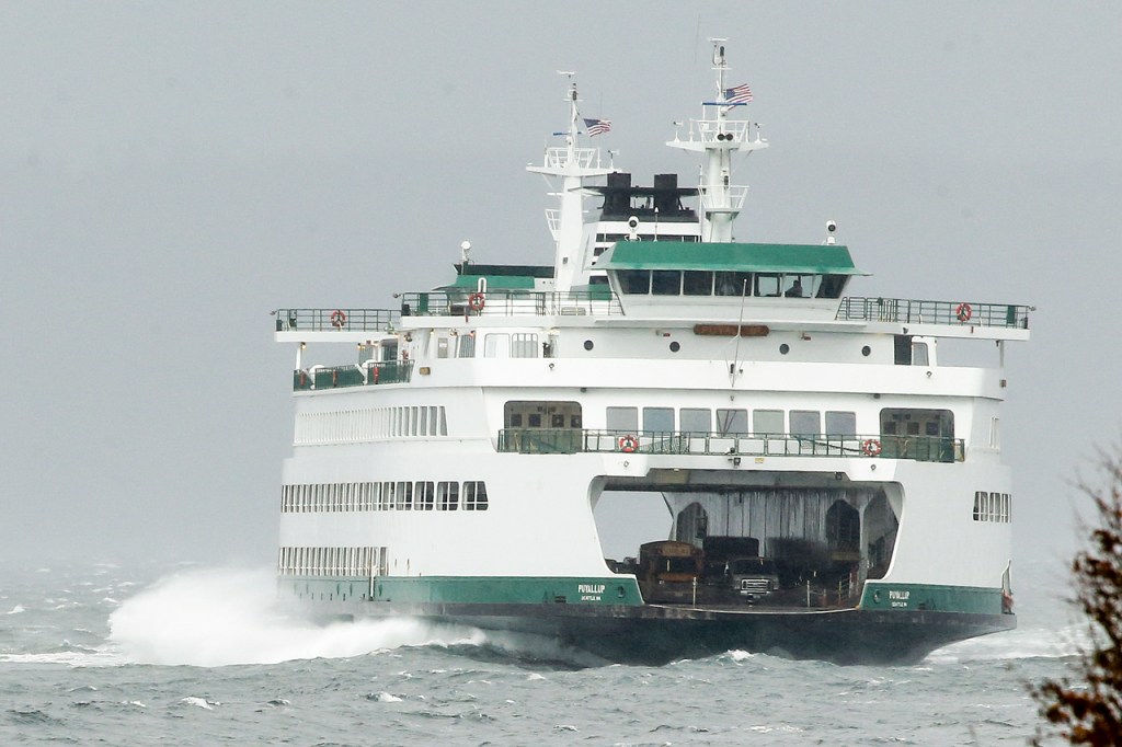 A Washington State ferry makes its way through waves to Edmonds on Friday, Oct. 14. High winds put the Edmonds-Kingston ferry behind schedule on Friday afternoon. (Ian Terry / The Herald)