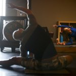 Carly Hayden (right) teaches a YogaMosa class at Bluewater Organic Distilling in Everett. (Ian Terry / The Herald)