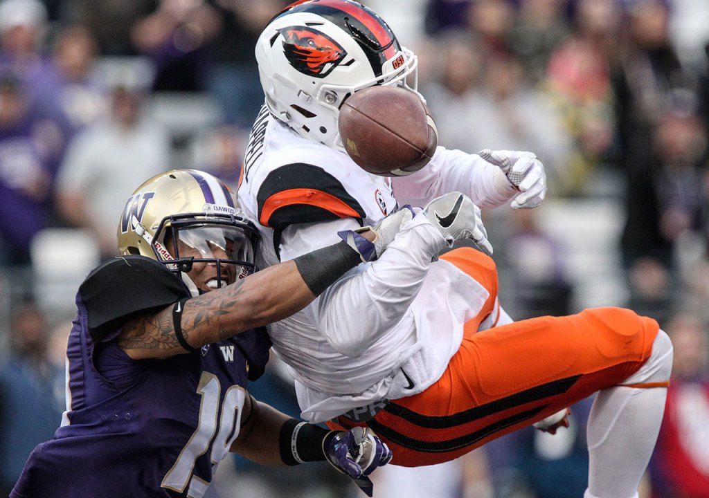Oregon State&rsquo;s Devin Chappell breaks up a pass intended for Washington&rsquo;s Andre Baccellia Saturday afternoon at Husky Stadium in Seattle. (Kevin Clark / The Herald)