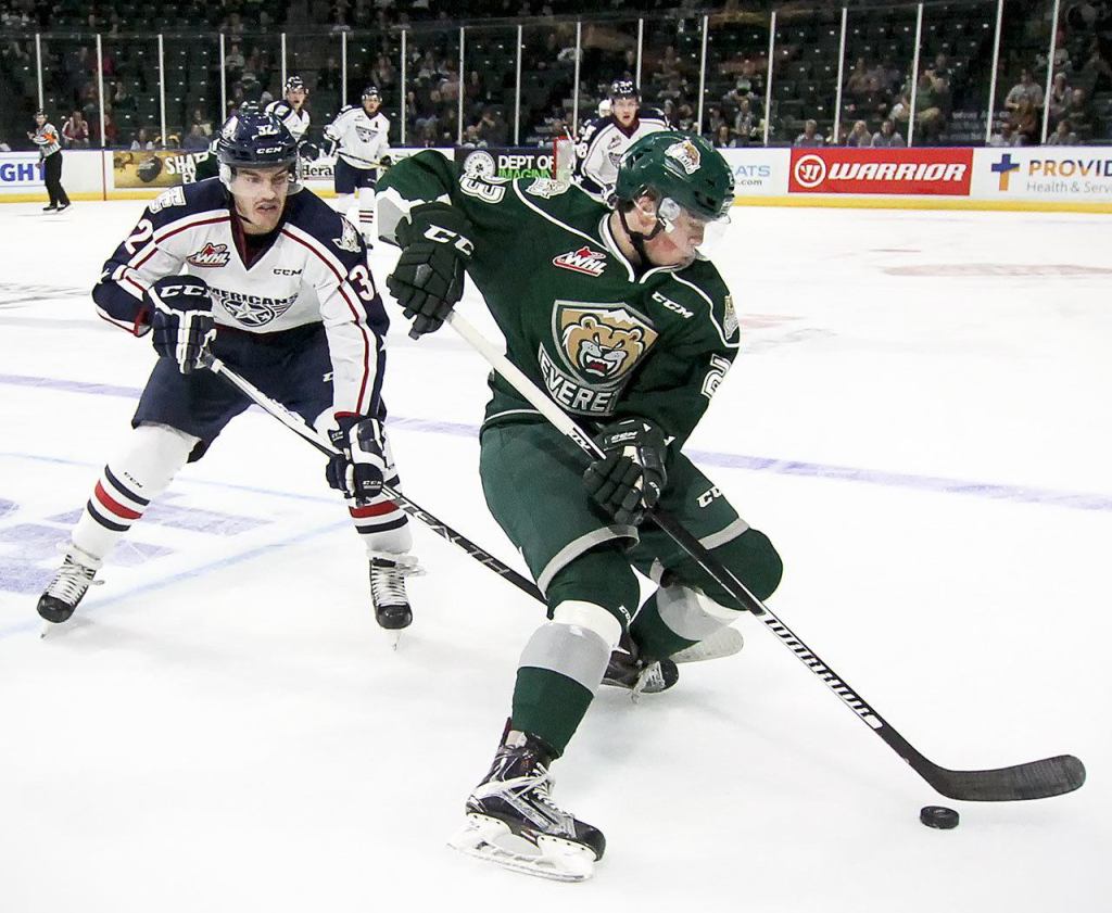 Everett&rsquo;s Jake Christiansen (right) controls the puck with Tri City&rsquo;s Parker AuCoin trailing in the first period of play Wednesday night at Xfinity Arena in Everett. (Kevin Clark / The Herald)