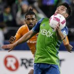 The Sounders&rsquo; Nicolas Lodeiro controls the ball with the Dynamo&rsquo;s Sheanon Williams trailing Wednesday night at Century Link Field in Seattle. (Kevin Clark / The Herald)