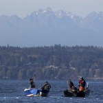 Fishermen in Tulalip Bay with the Olympic Mountains looming in the background.                                (Ian Terry / The Herald)