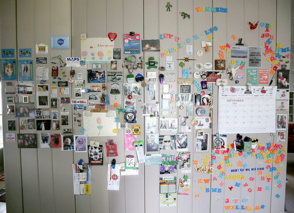 Magnets cover most of a wall in Sue Williams&rsquo; Lustron home, a prefab steel hous. (Michael Chritton/Akron Beacon Journal)