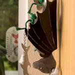 A metallic key holder in the shape of a fruit bat hangs in the Ogaard&rsquo;s kitchen. (Andy Bronson / The Herald)