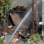 Firefighters battle a blaze after a gas explosion in Portland, Oregon, on Wednesday. (AP Photo/Don Ryan)